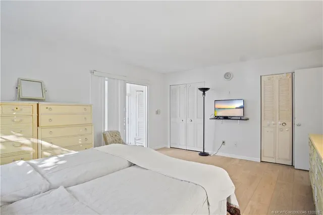 a bedroom with a bed and a cabinets