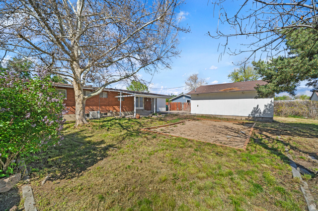 2267 West 4350th Street South Roy, UT 84067 - Photo 32 of 32 View of yard with a patio area and an outbuilding