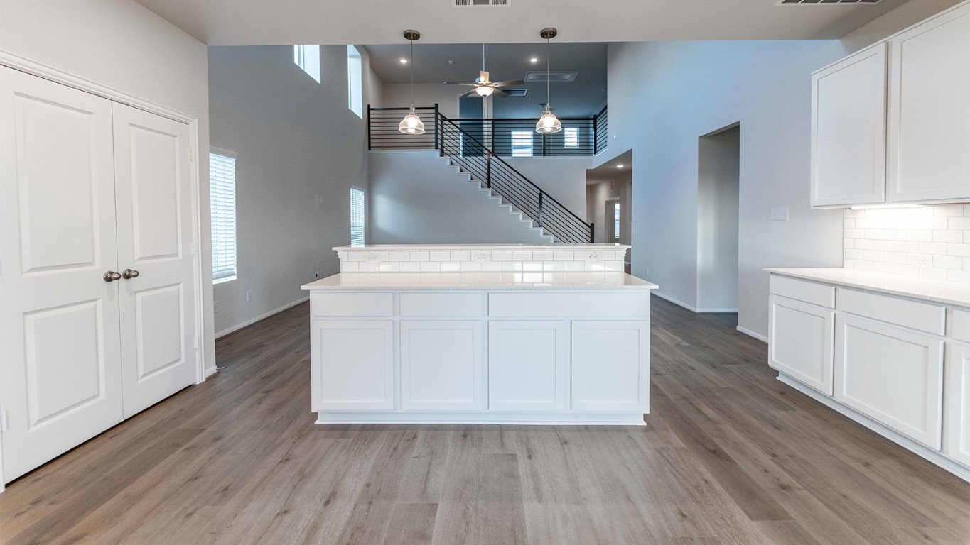 280 Yosemite Drive Kyle, TX 78640 - Photo 8 of 18 wooden floor in an empty room with wooden floor