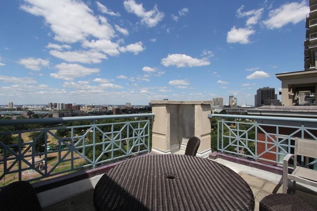170 Tremont Street, Unit 606 Boston, MA 02111 - Photo 18 of 19 a view of a balcony with furniture