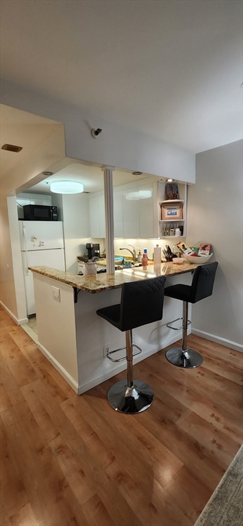 170 Tremont Street, Unit 606 Boston, MA 02111 - Photo 4 of 19 a room with cabinets and pool table