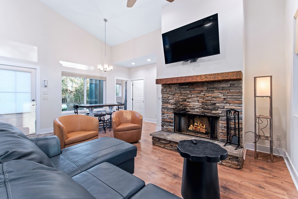 1001 Sunset Road Epworth, GA 30541 - Photo 24 of 36 a living room with furniture a flat screen tv and a fireplace