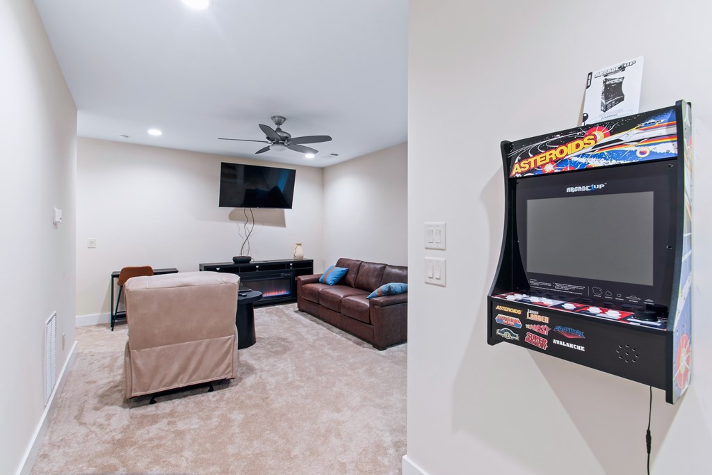 1001 Sunset Road Epworth, GA 30541 - Photo 33 of 36 a living room with furniture and a flat screen tv