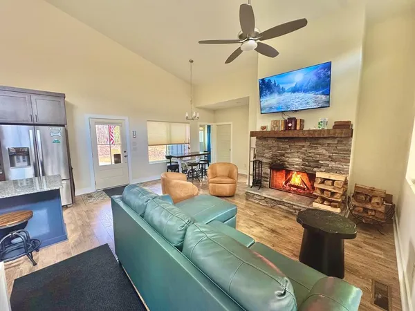 a living room with furniture a fireplace
