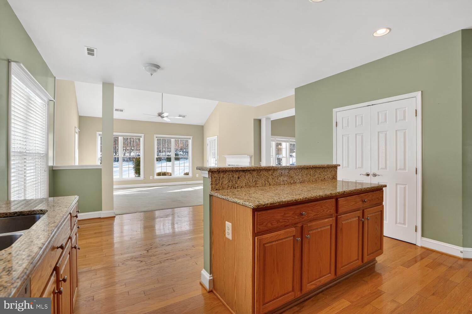 6767 Derby Run Way Gainesville, VA 20155 - Photo 22 of 37 a kitchen with granite countertop a stove and cabinets