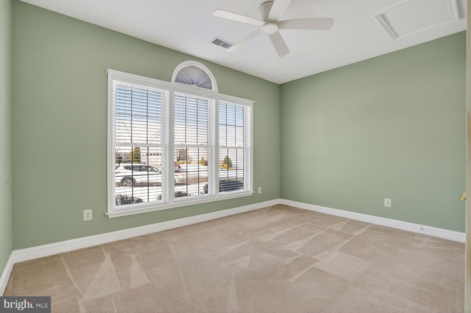 6767 Derby Run Way Gainesville, VA 20155 - Photo 26 of 37 an empty room with windows and chandelier fan