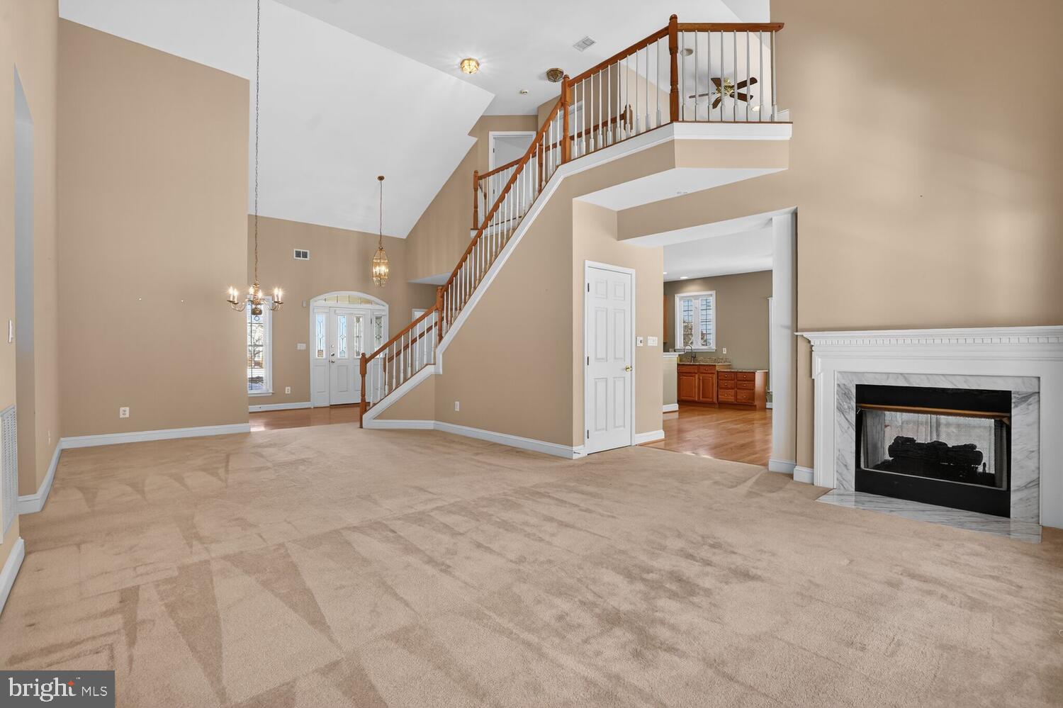 6767 Derby Run Way Gainesville, VA 20155 - Photo 3 of 37 a view of a livingroom with an empty space and a fireplace