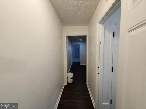 a view of a bathroom from a hallway
