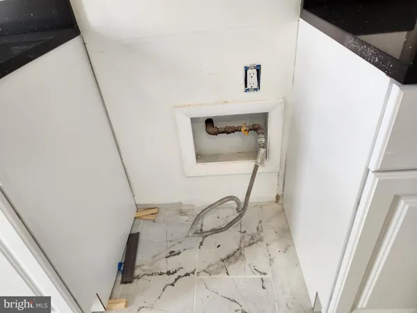 a view of a kitchen from the stairs