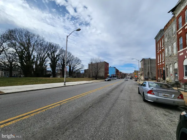 a city street lined with tall buildings
