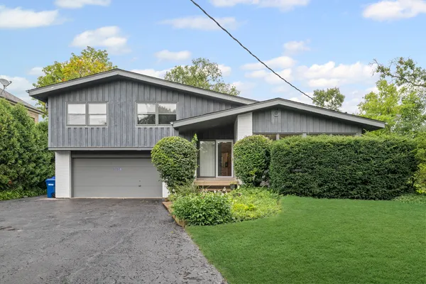 a house with a yard plants and big yard
