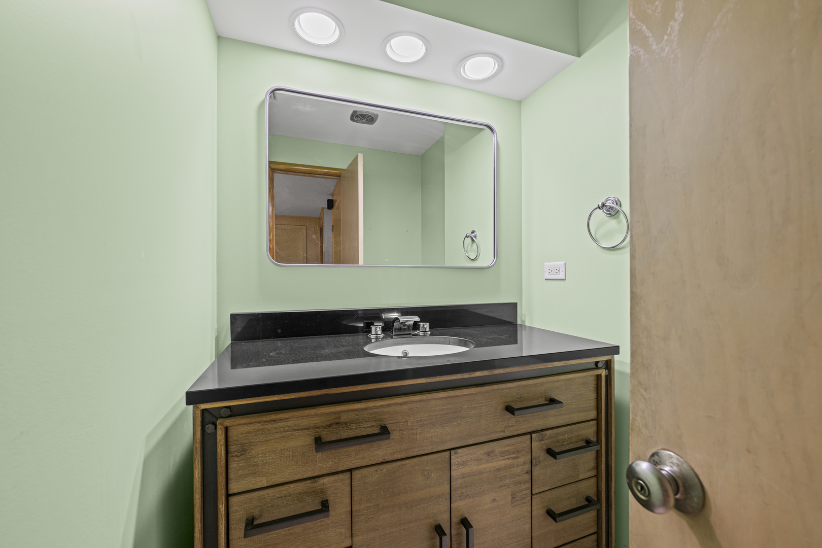 1125 Hohlfelder Road Glencoe, IL 60022 - Photo 9 of 25 a bathroom with a sink and a mirror