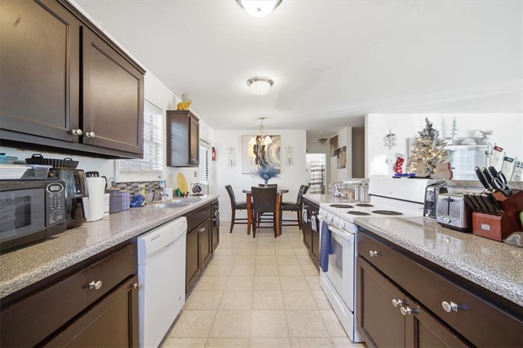 6283 Susan Lane Doraville, GA 30340 - Photo 11 of 34 a large kitchen with stainless steel appliances granite countertop lots of counter top space