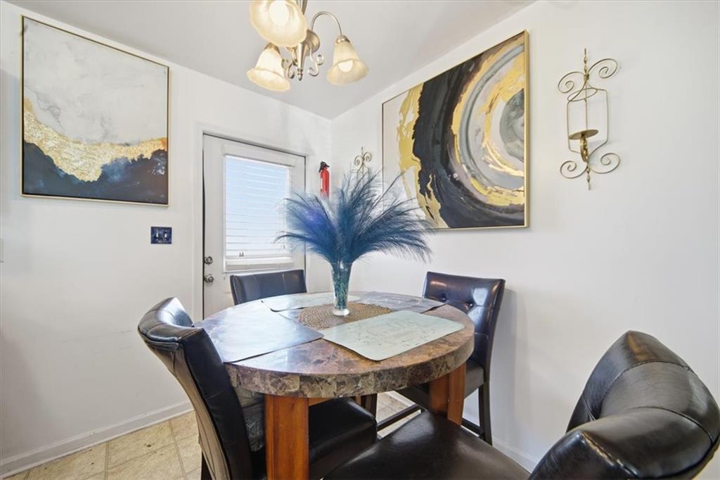 6283 Susan Lane Doraville, GA 30340 - Photo 12 of 34 a view of a dining room with furniture and wooden floor