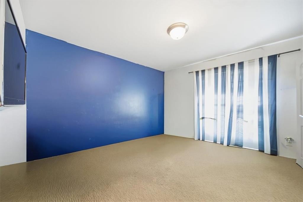 6283 Susan Lane Doraville, GA 30340 - Photo 18 of 34 a view of a room with a wooden floor and a window