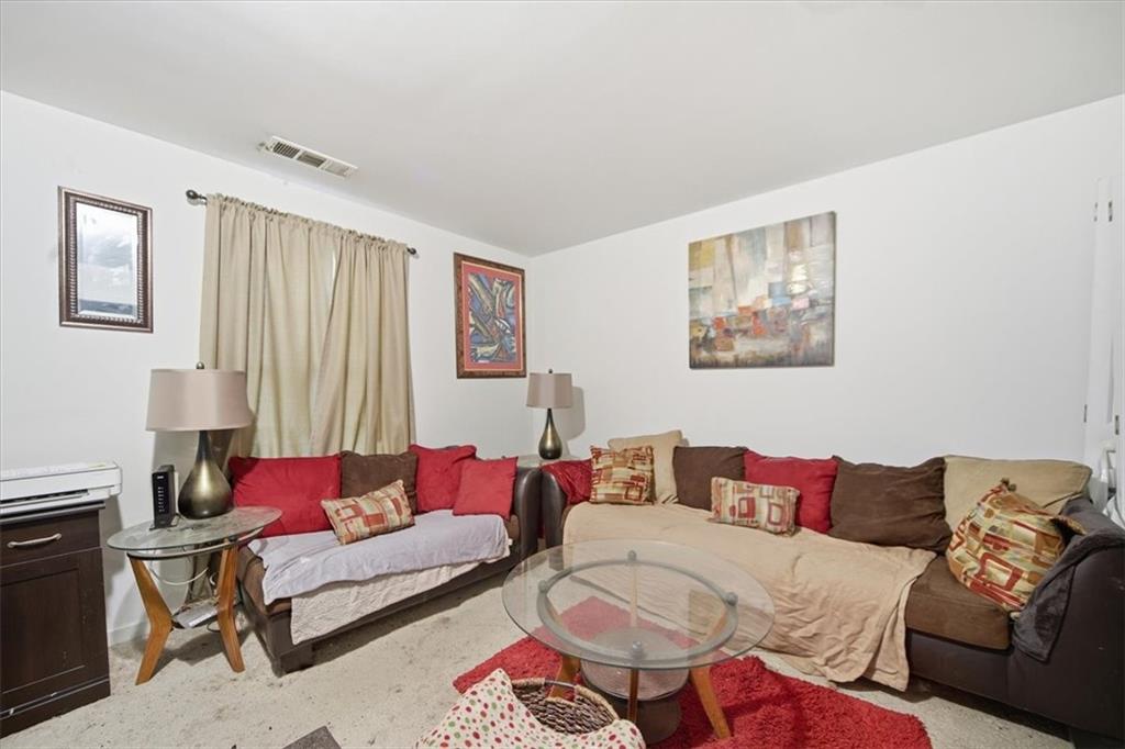 6283 Susan Lane Doraville, GA 30340 - Photo 19 of 34 a living room with furniture and a couch