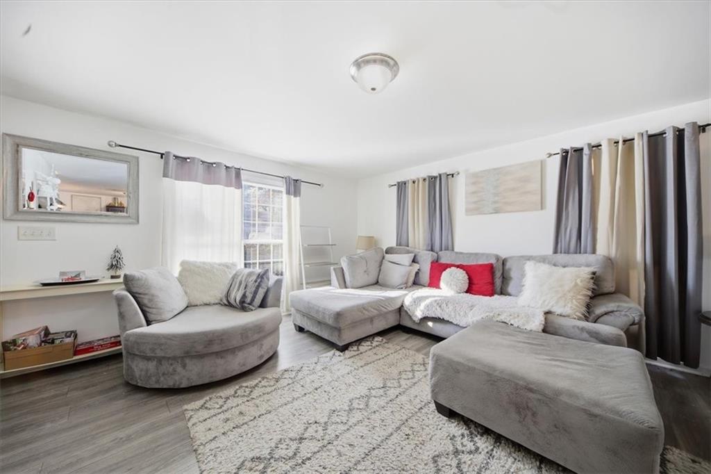 6283 Susan Lane Doraville, GA 30340 - Photo 7 of 34 a living room with furniture and a large window