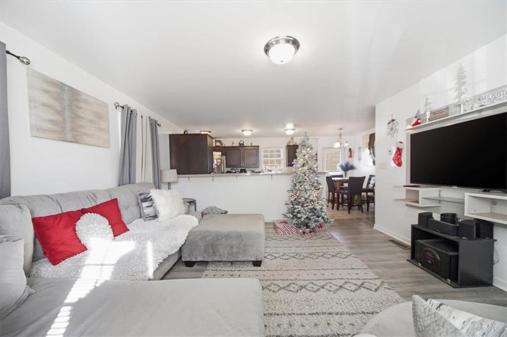 6283 Susan Lane Doraville, GA 30340 - Photo 9 of 34 a living room with furniture and a flat screen tv