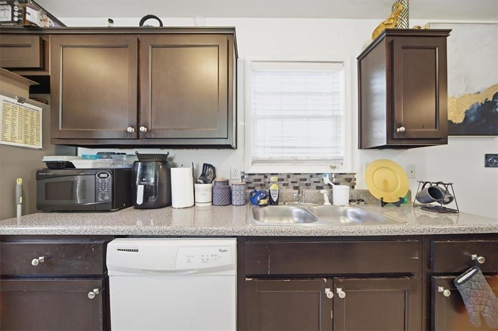 6283 Susan Lane Doraville, GA 30340 - Photo 10 of 34 a bathroom with sink granite and a mirror