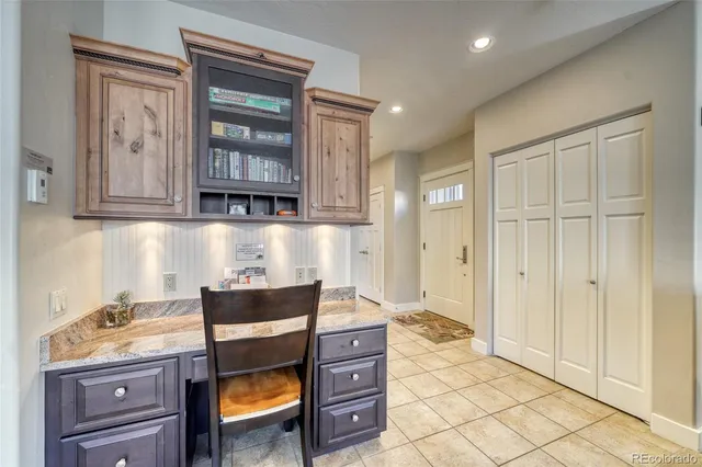 a kitchen with a wooden cabinets and a stove top oven
