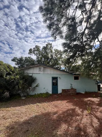 a backyard of a house with lots of green space