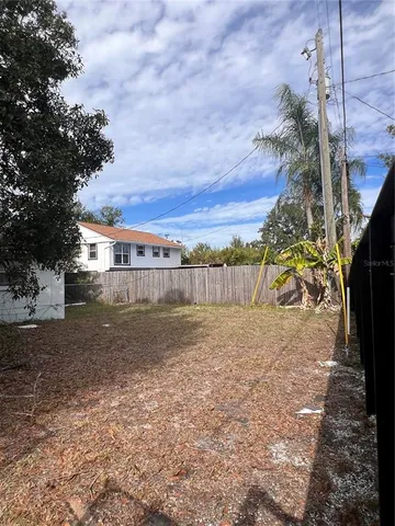 a view of backyard with green space