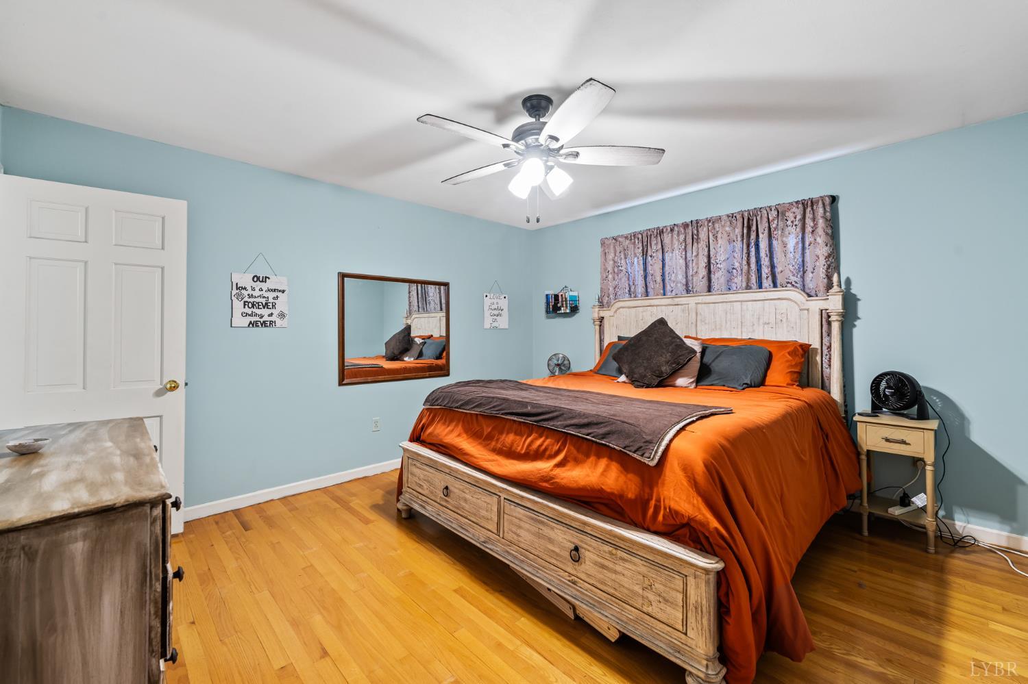 1872 Wards Road Hurt, VA 24563 - Photo 17 of 54 a bedroom with a bed and a chandelier
