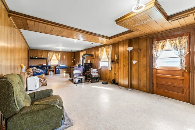 a view of a livingroom with furniture and a window