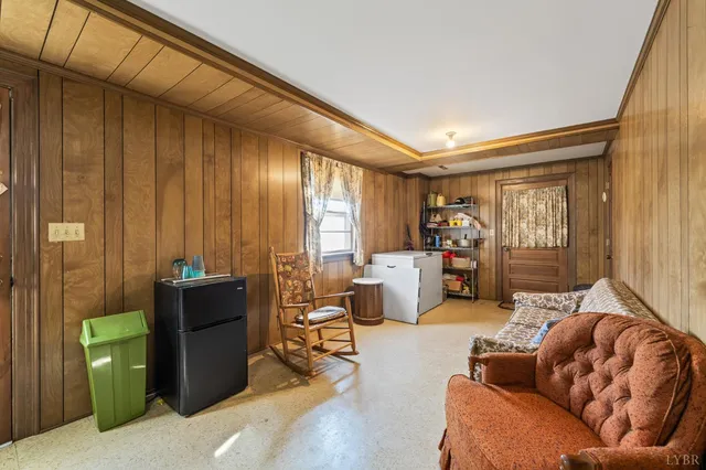 a living room with furniture a ceiling fan and a window