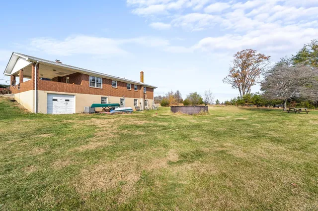 a view of a field with ocean view