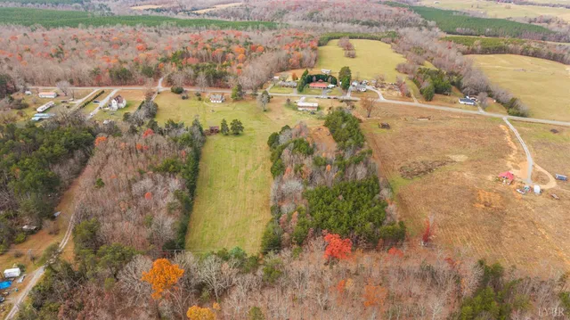 a swimming pool with outdoor seating and yard