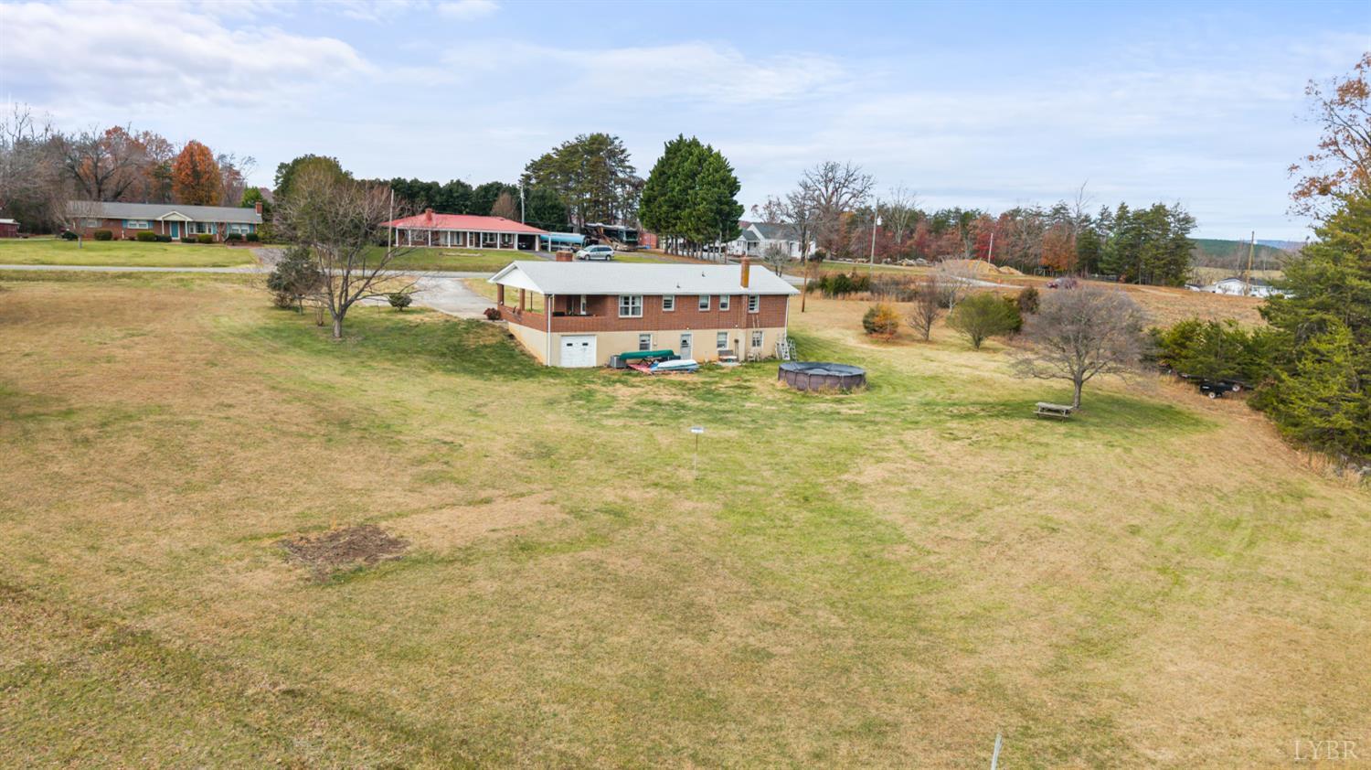 1872 Wards Road Hurt, VA 24563 - Photo 49 of 54 a swimming pool with outdoor seating and yard