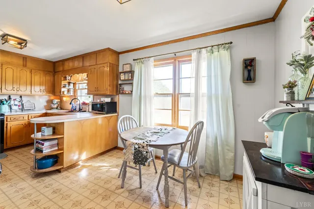 a dining room with a table and chairs