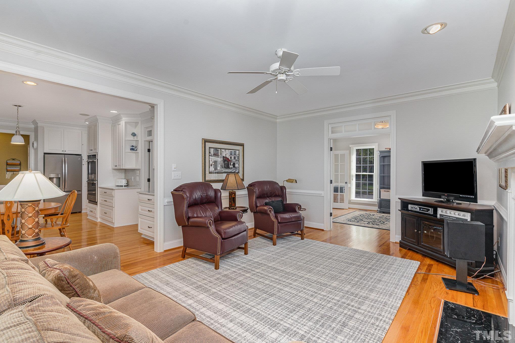 9409 Stone Mountain Road Raleigh, NC 27613 - Photo 13 of 53 a living room with furniture and a flat screen tv