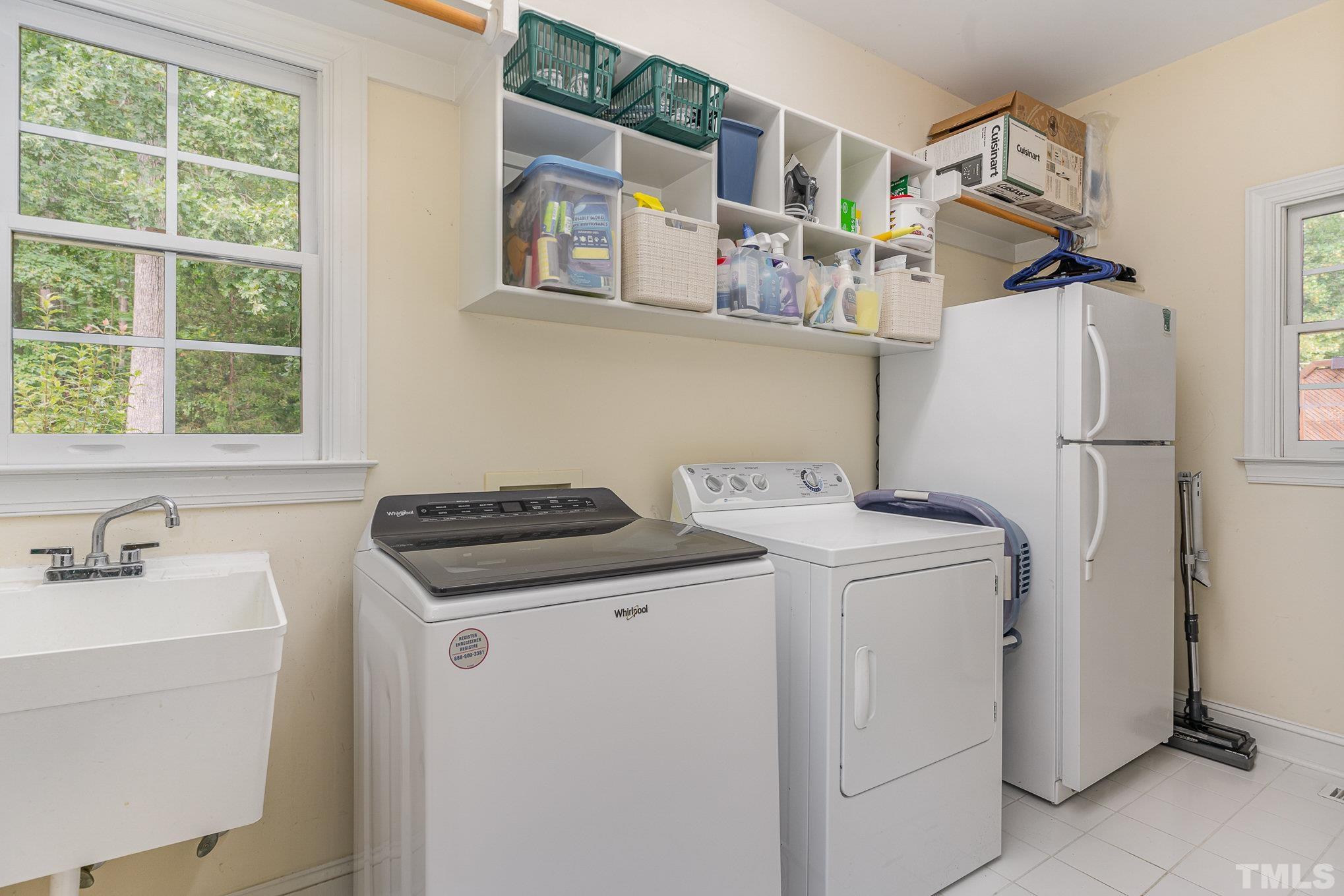 9409 Stone Mountain Road Raleigh, NC 27613 - Photo 20 of 53 a utility room with dryer and washer