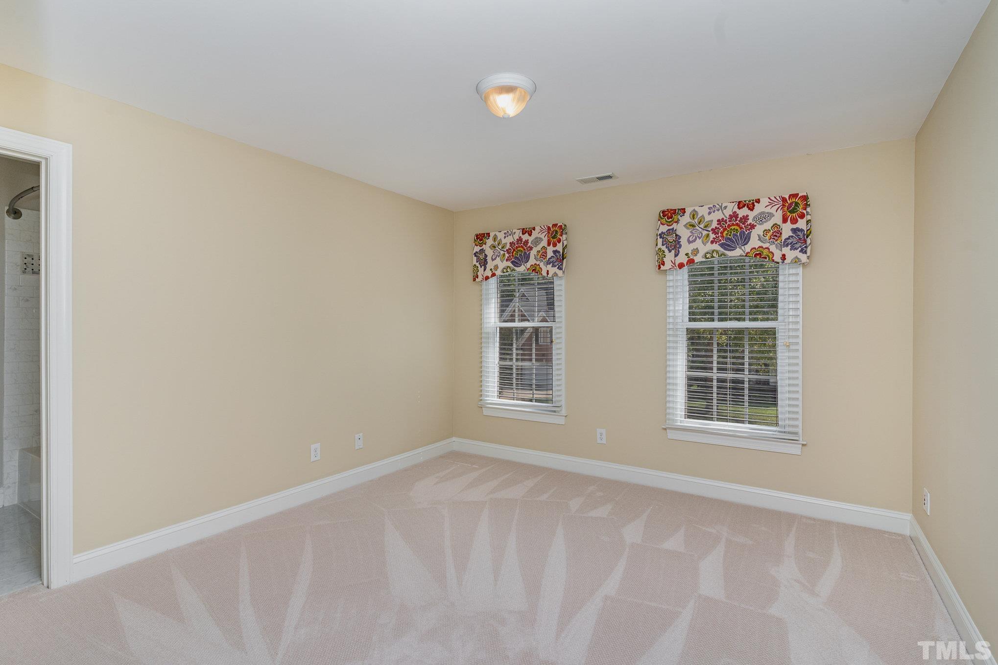 9409 Stone Mountain Road Raleigh, NC 27613 - Photo 27 of 53 a view of an empty room with a window