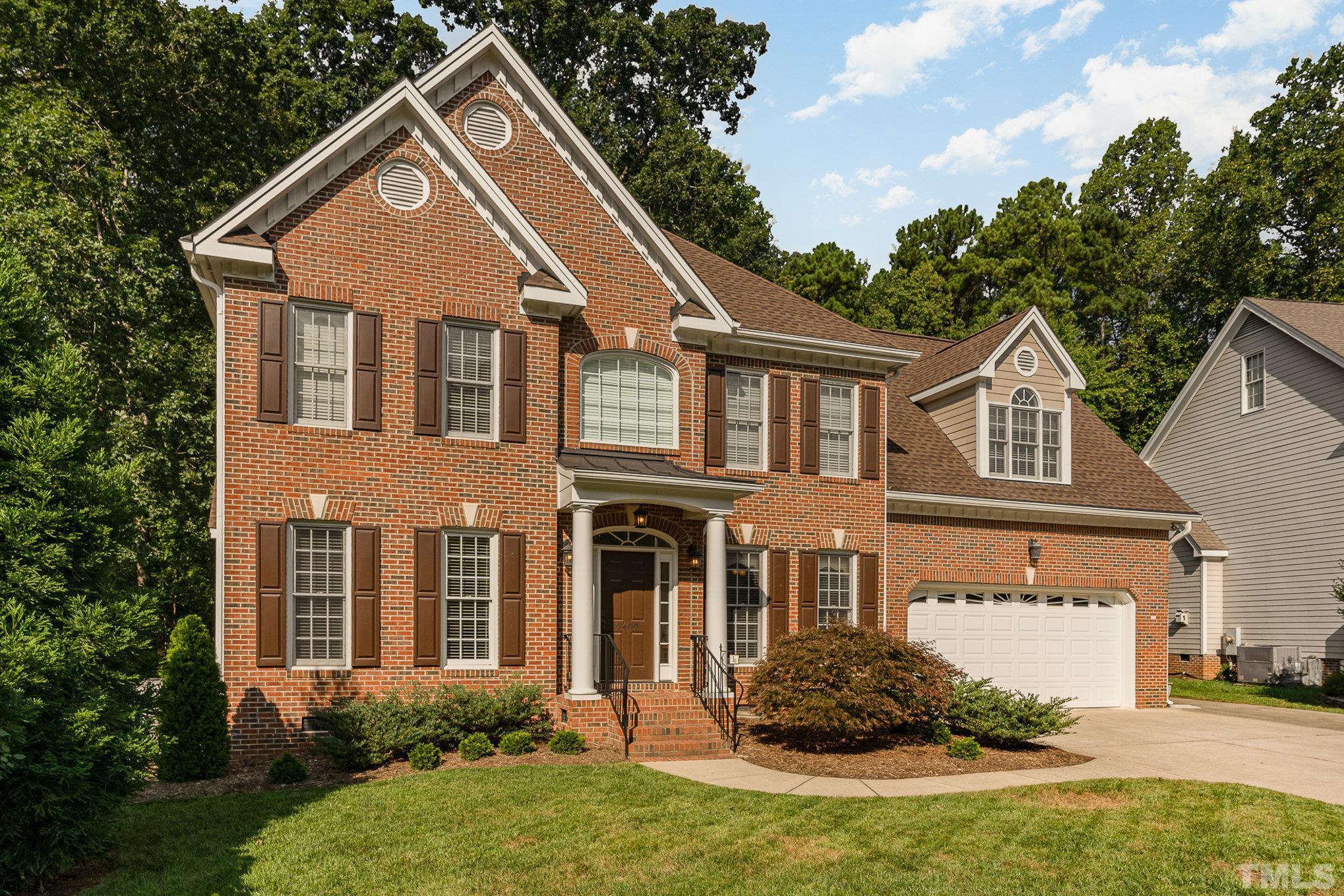 9409 Stone Mountain Road Raleigh, NC 27613 - Photo 4 of 53 a front view of a house with a yard