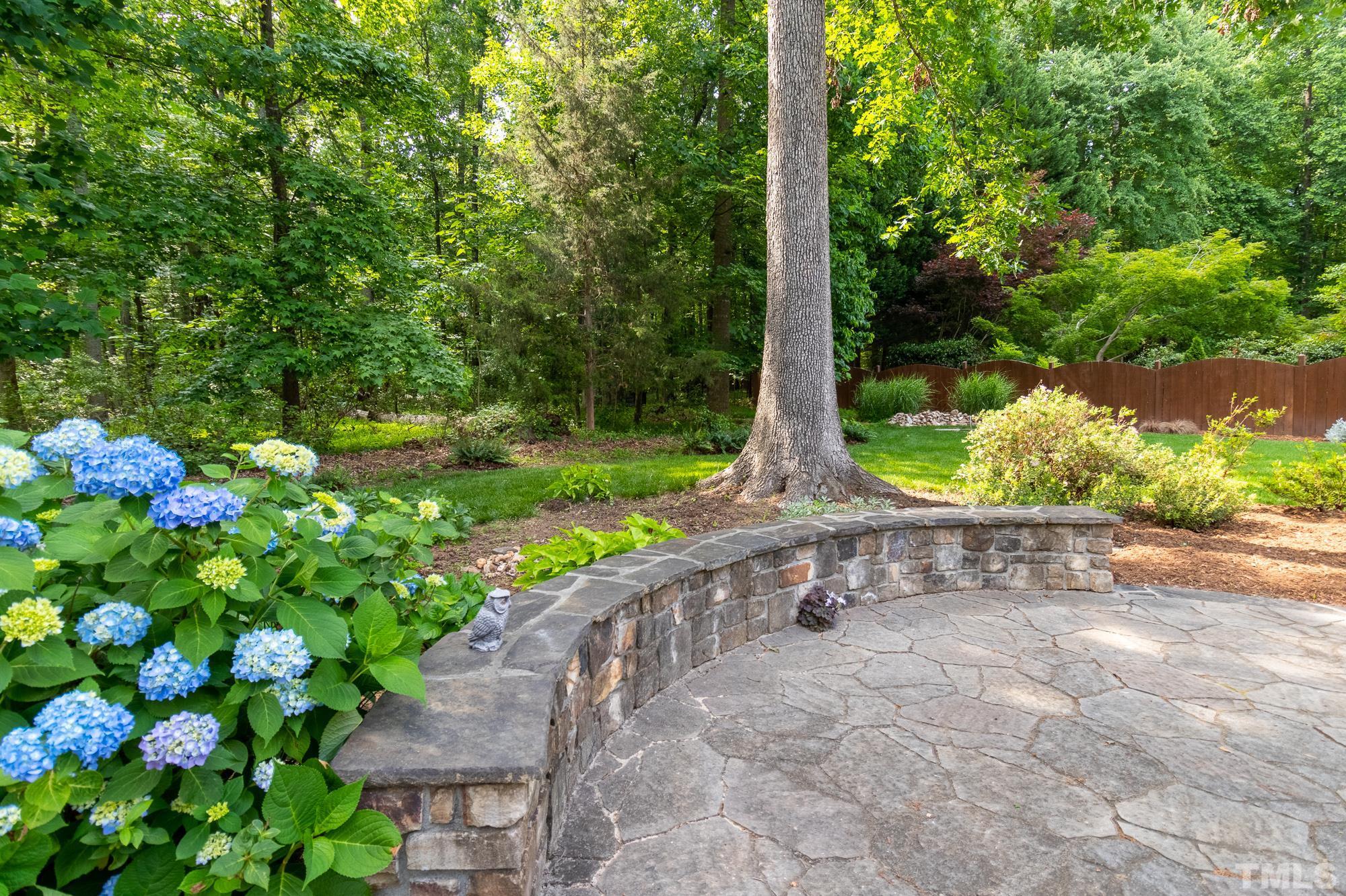 9409 Stone Mountain Road Raleigh, NC 27613 - Photo 42 of 53 a view of a pathway with a tree