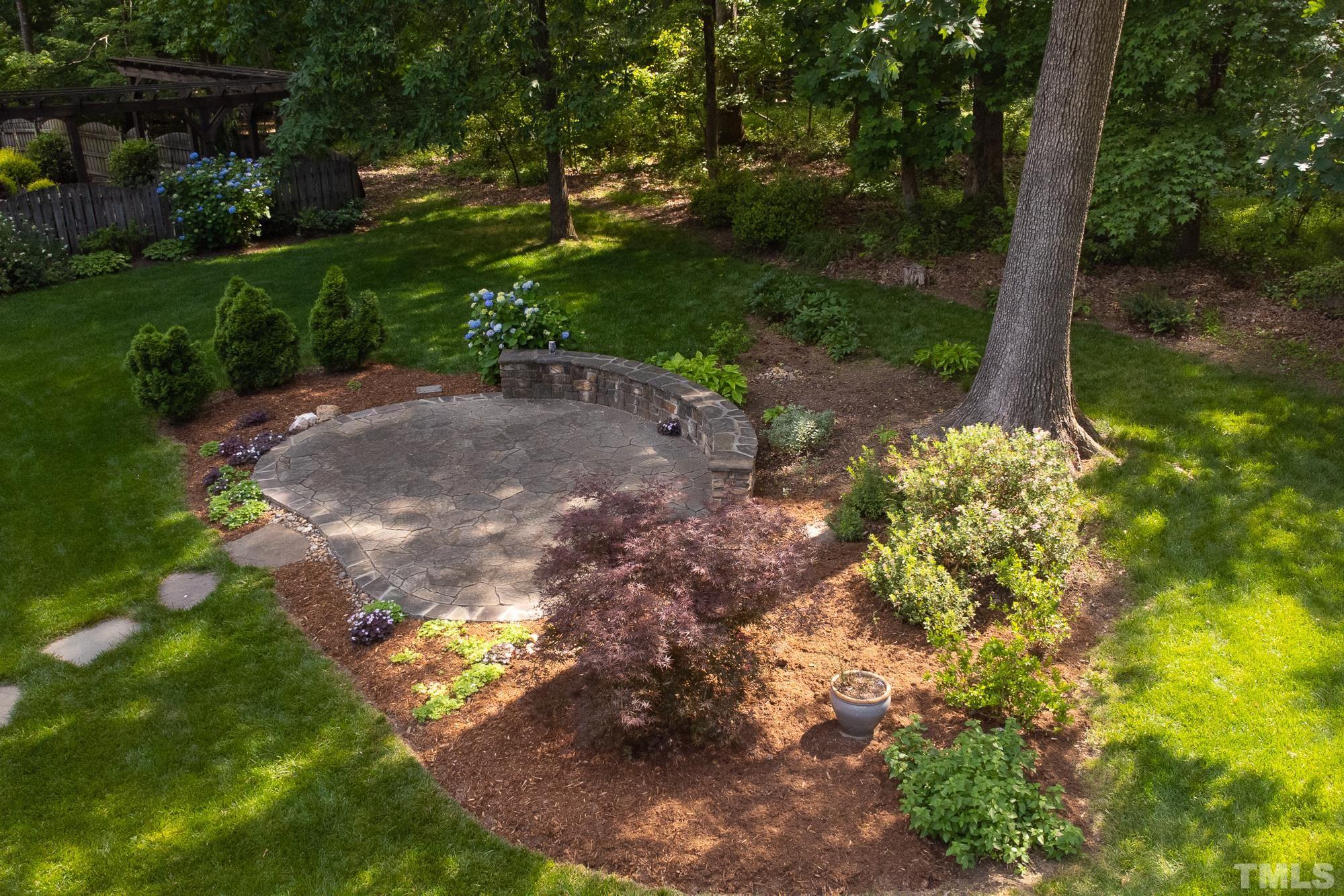 9409 Stone Mountain Road Raleigh, NC 27613 - Photo 47 of 53 a view of a street with a yard