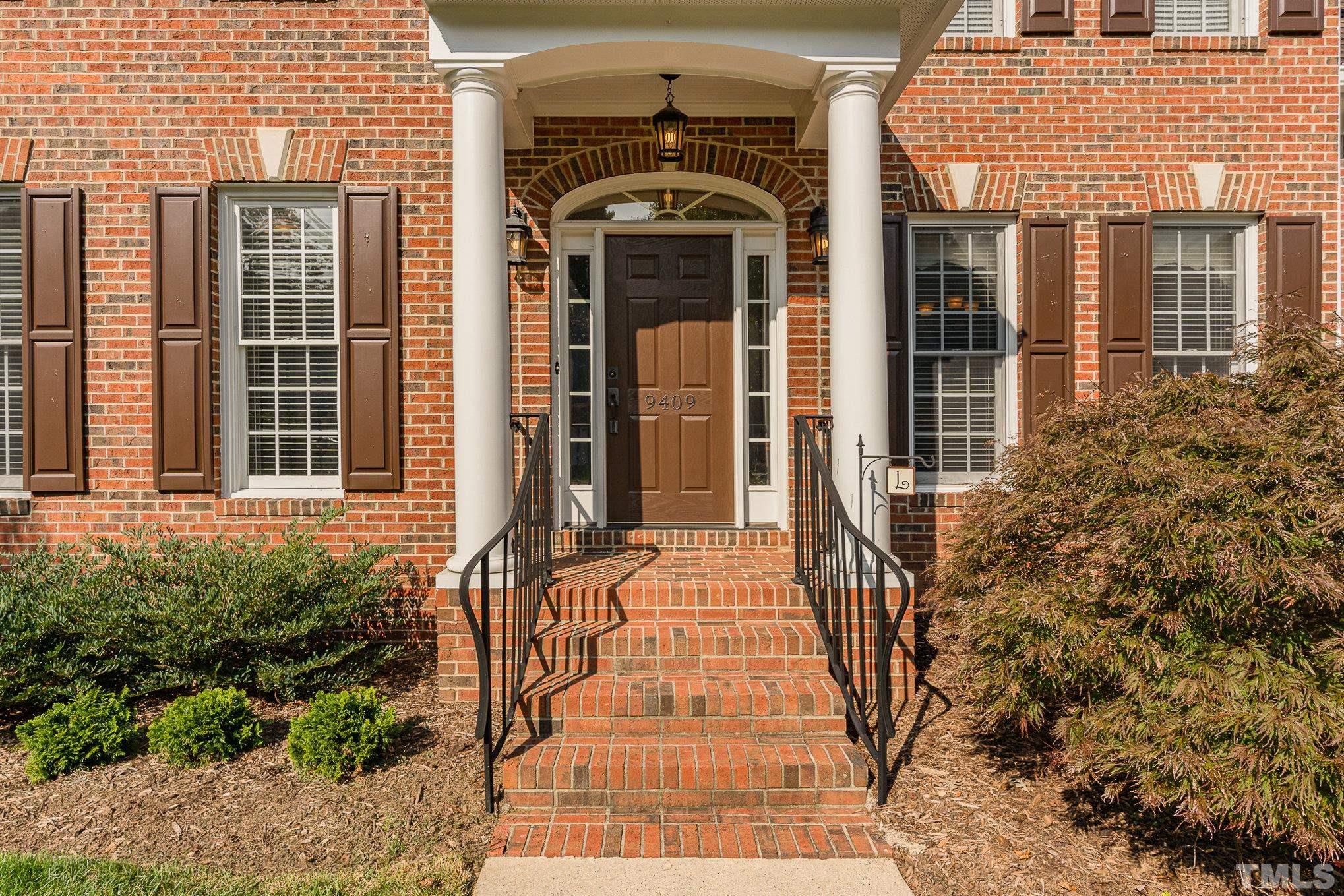 9409 Stone Mountain Road Raleigh, NC 27613 - Photo 5 of 53 a front view of a house with a yard
