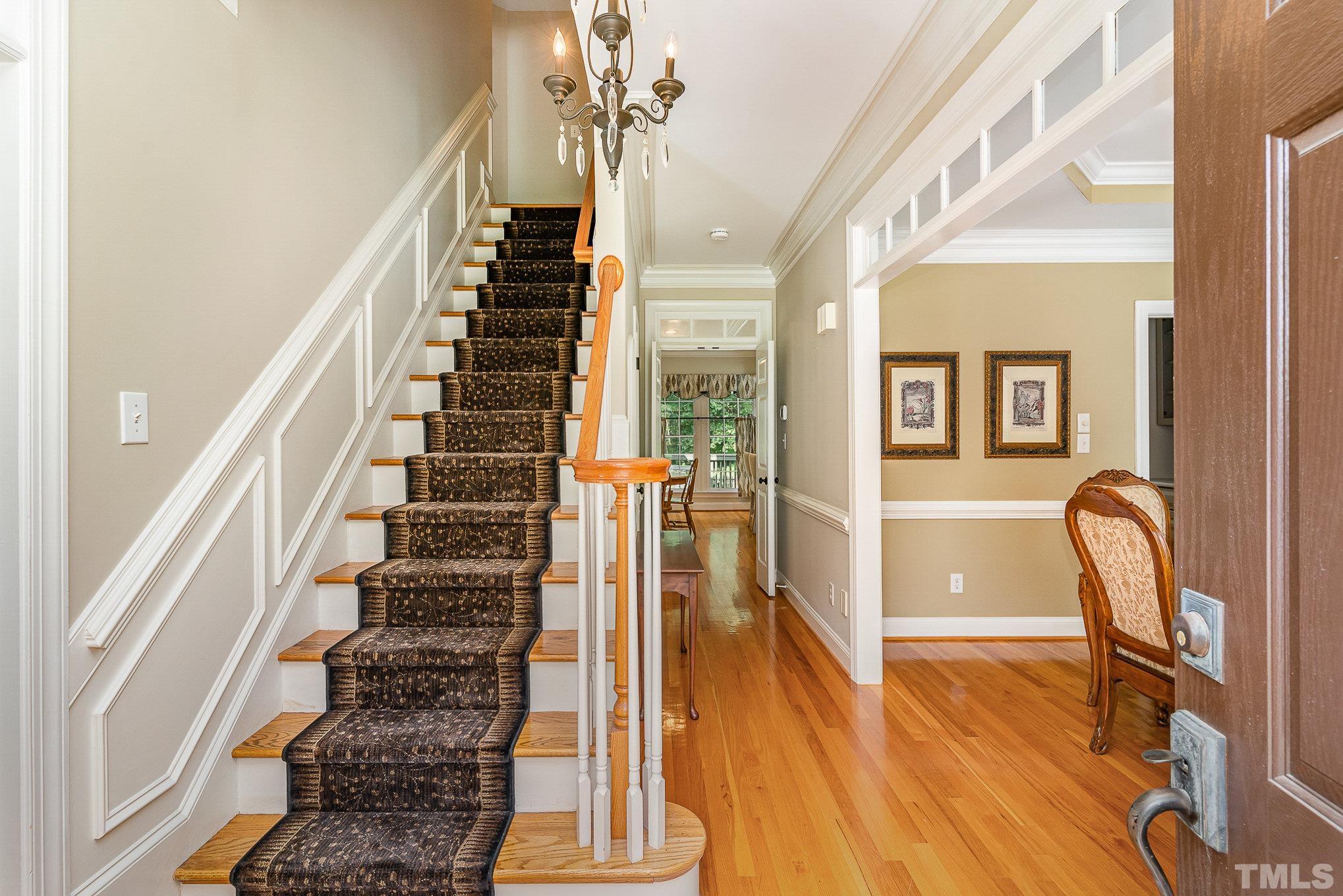 9409 Stone Mountain Road Raleigh, NC 27613 - Photo 7 of 53 a view of entryway and hall with wooden floor