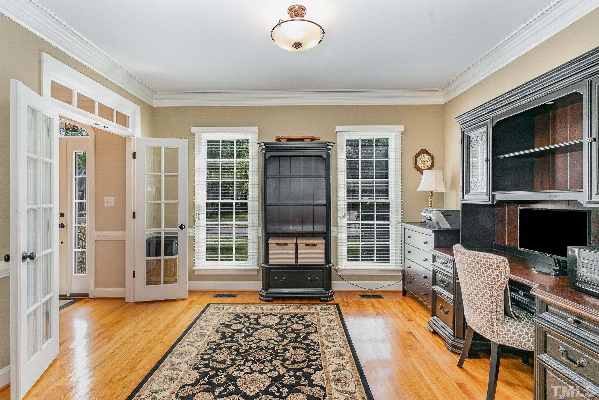 9409 Stone Mountain Road Raleigh, NC 27613 - Photo 10 of 53 a bedroom with furniture and a window