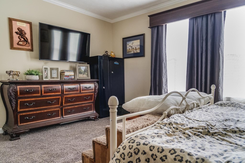 3689 Bryan Road Kodak, TN 37764 - Photo 18 of 41 a bedroom with a bed and a flat screen tv