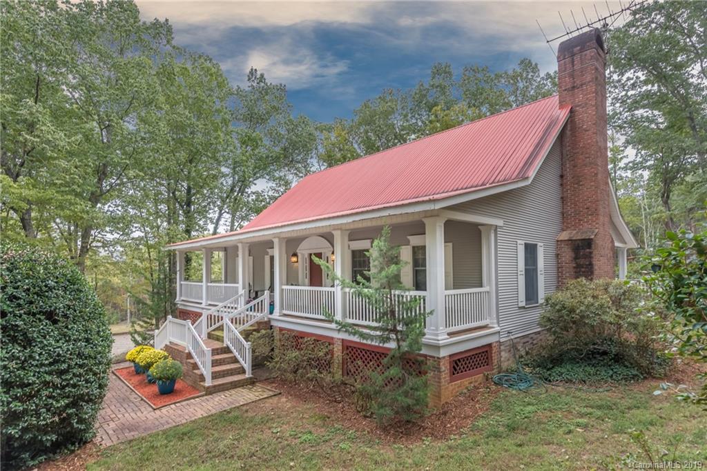 295 Mockingbird Hill Road Landrum, SC 29356 - Photo 8 of 38 a view of a house with yard and sitting area