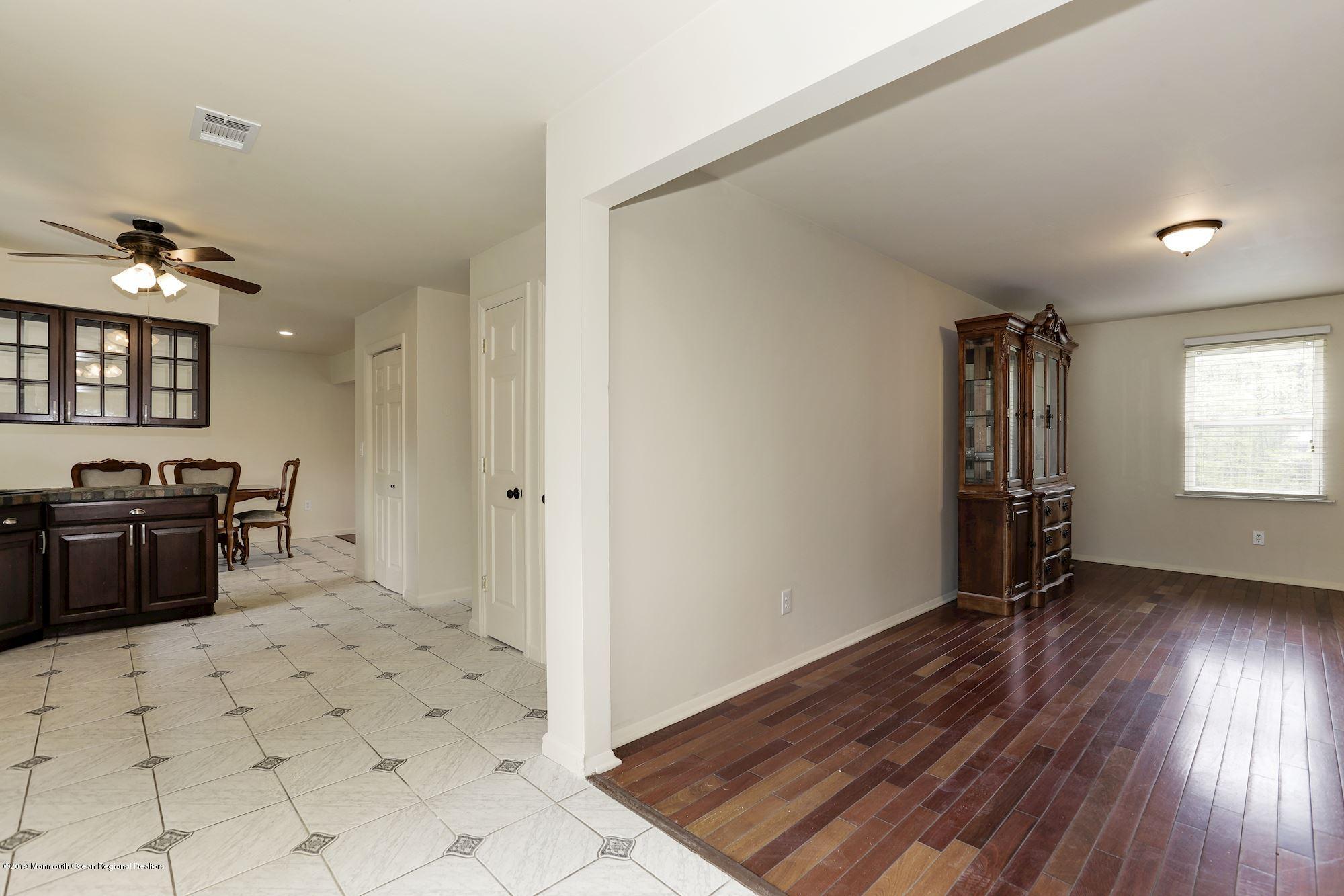 460 Cedar Swamp Road Jackson, NJ 08527 - Photo 15 of 38 a view of a kitchen with a sink cabinets and wooden floor