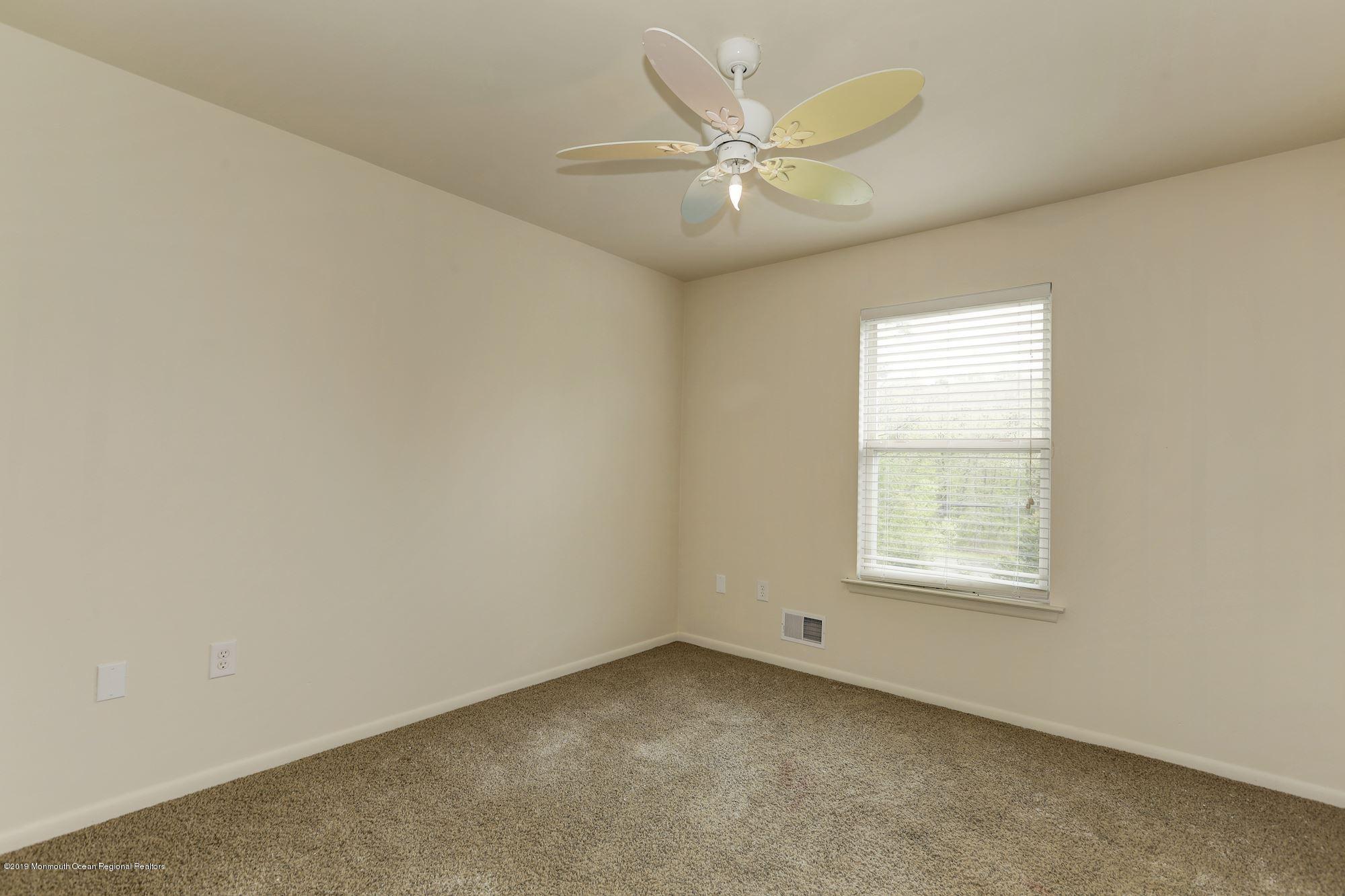 460 Cedar Swamp Road Jackson, NJ 08527 - Photo 23 of 38 an empty room with a window