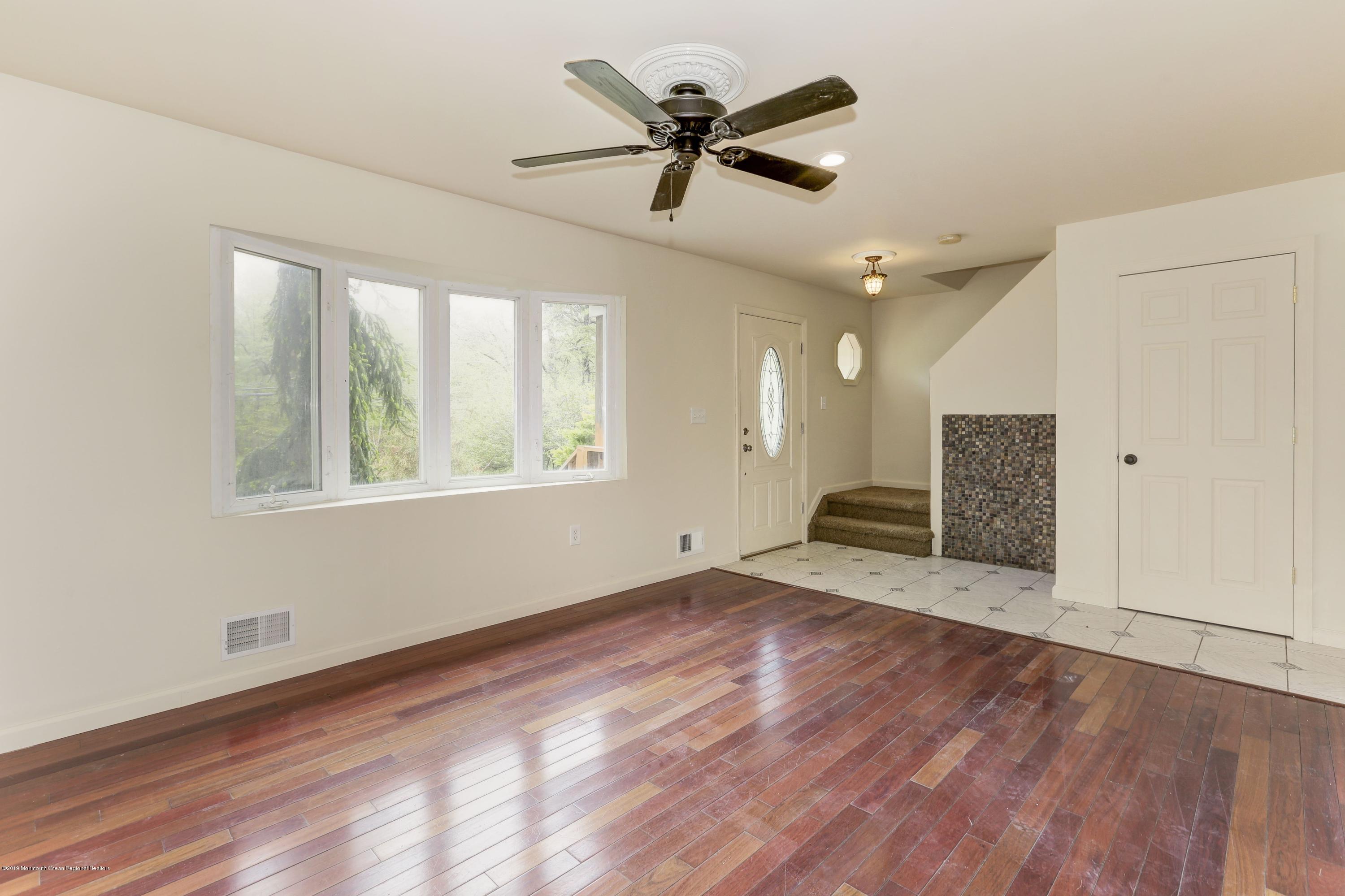 460 Cedar Swamp Road Jackson, NJ 08527 - Photo 4 of 38 a view of an empty room with a window