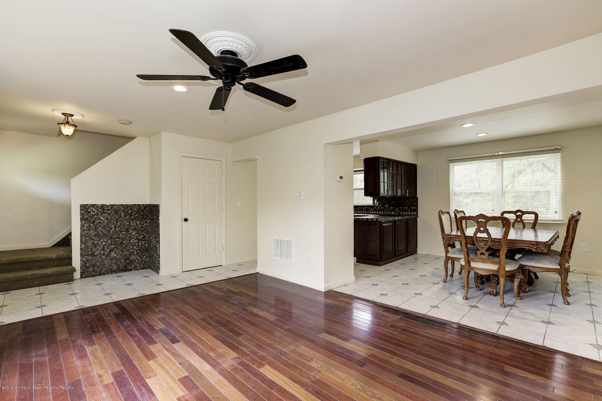 460 Cedar Swamp Road Jackson, NJ 08527 - Photo 7 of 38 a view of a dining room with furniture and wooden floor
