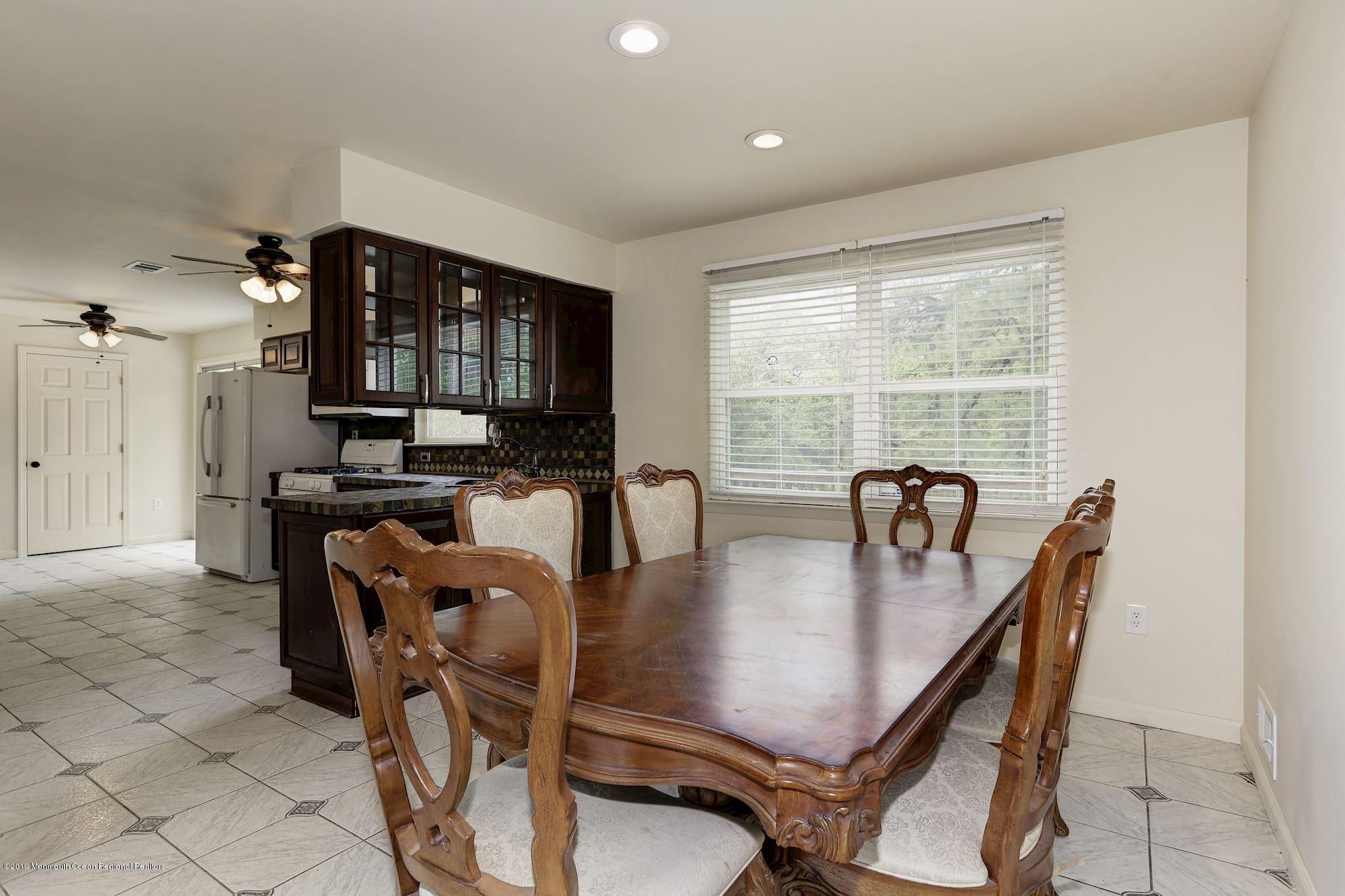 460 Cedar Swamp Road Jackson, NJ 08527 - Photo 8 of 38 a dining room with furniture and window