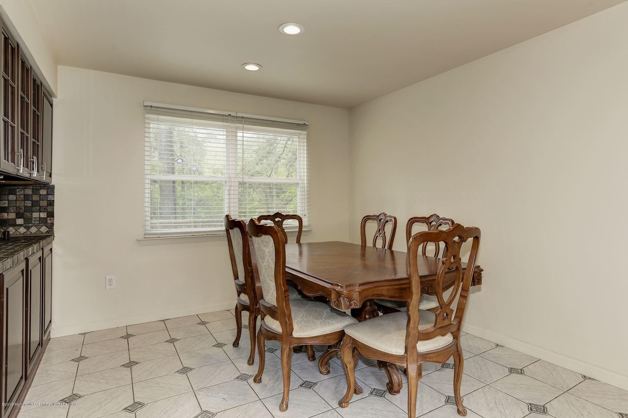 460 Cedar Swamp Road Jackson, NJ 08527 - Photo 9 of 38 a dining room with furniture and window